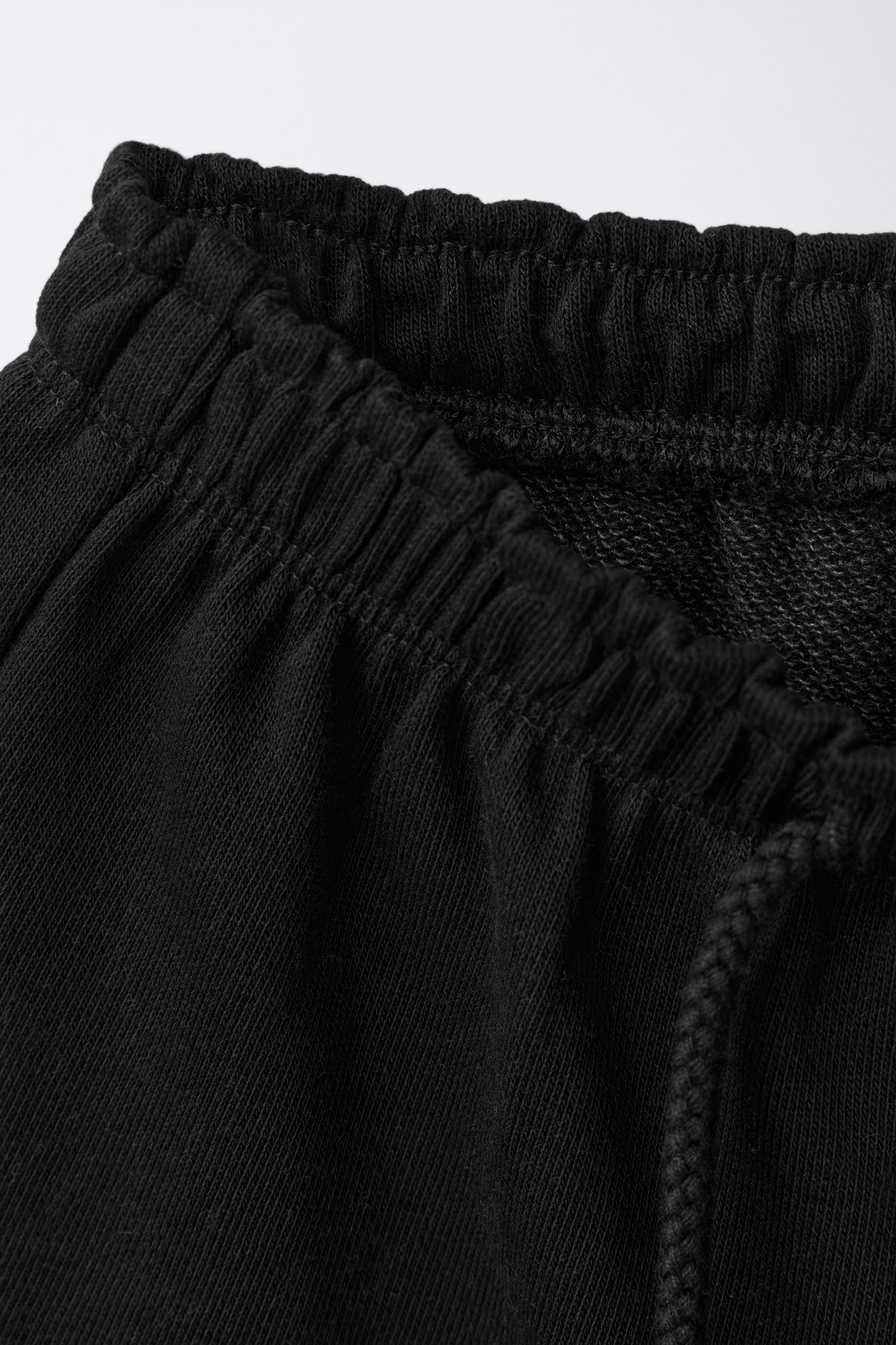 RUBBERIZED APPLIQUÉ PLUSH SHORTS